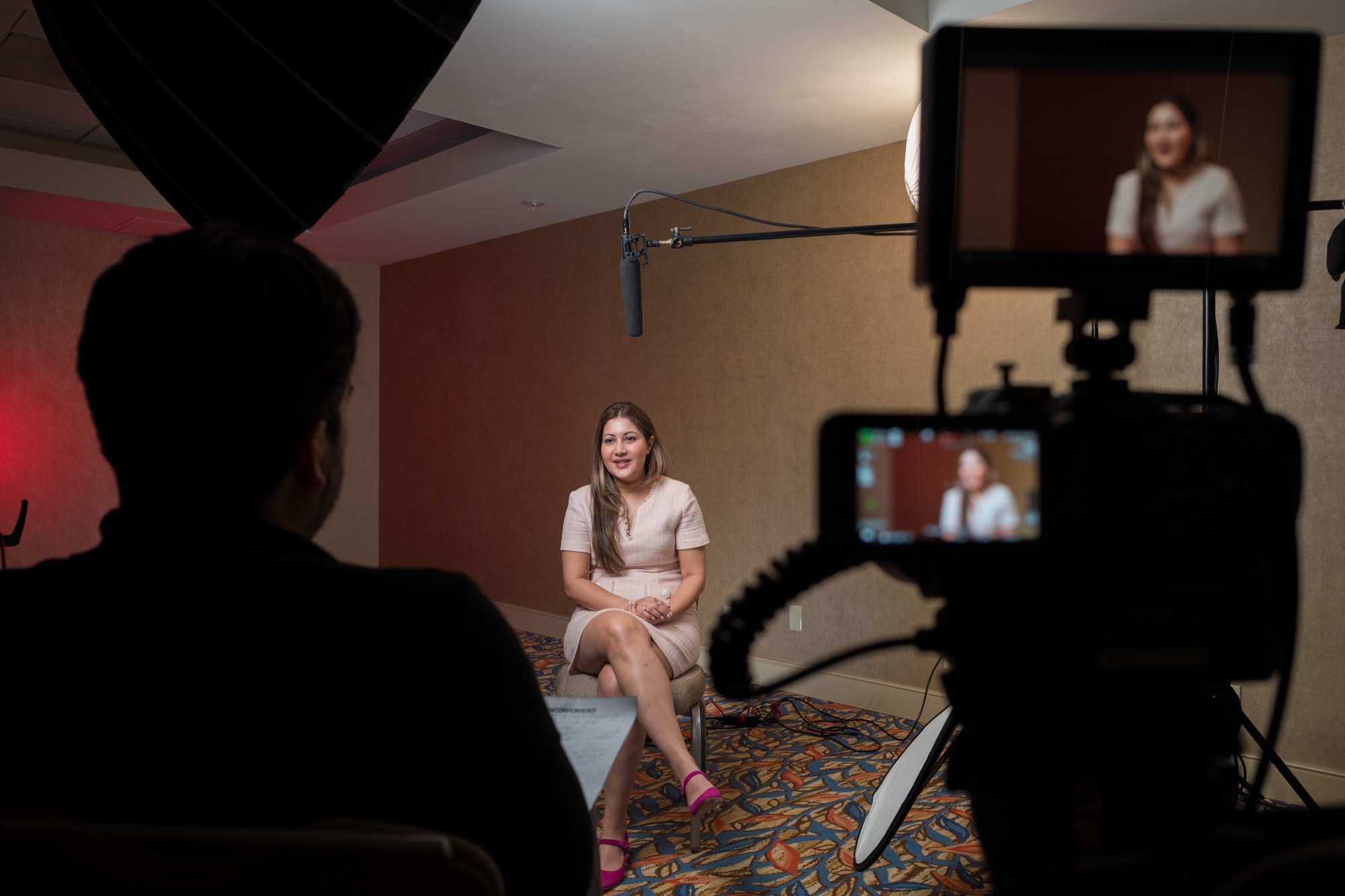 Carlos Foster directing a brand film interview, soft natural lighting on the subject
