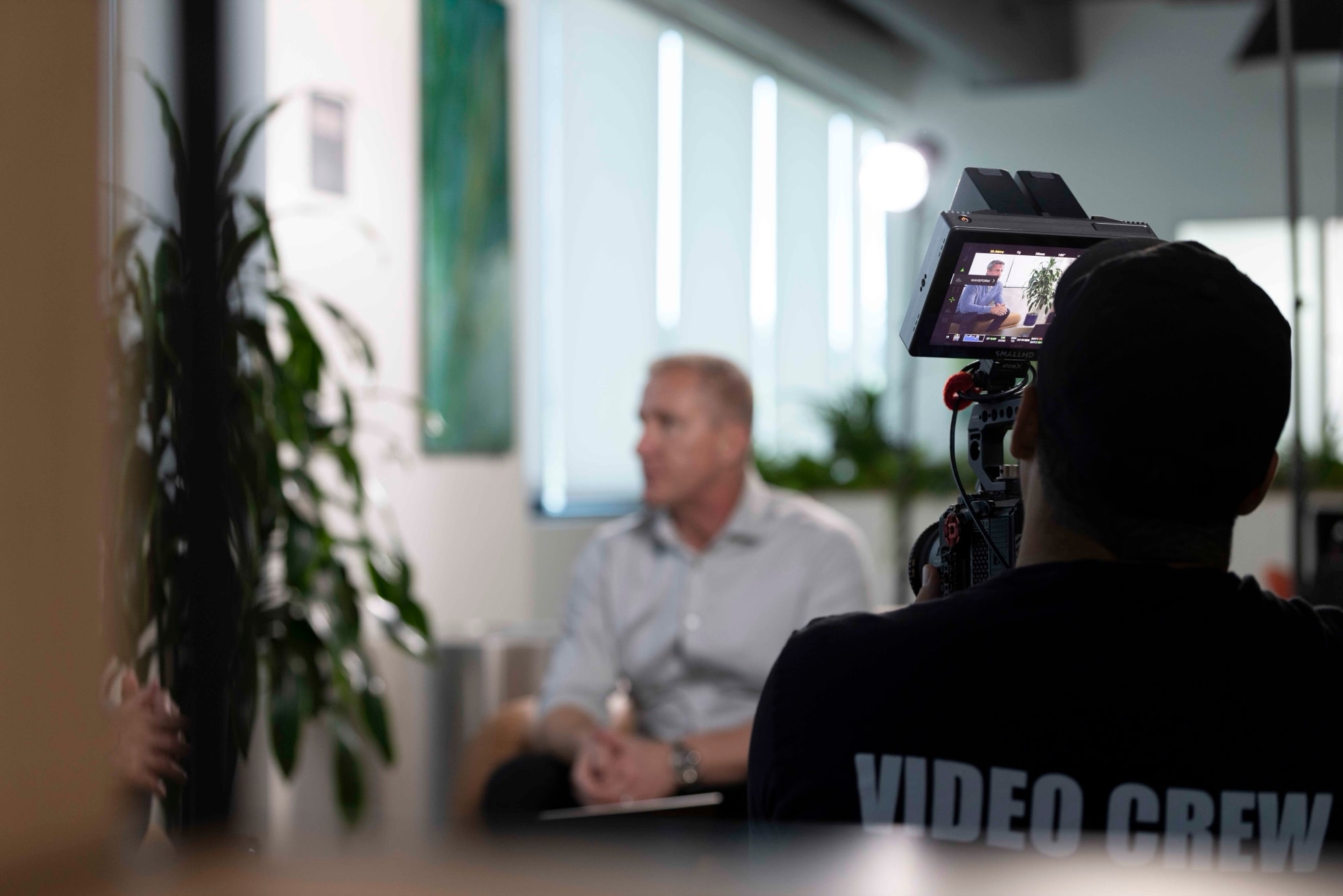 Blue Barn videographer filming a corporate interview subject