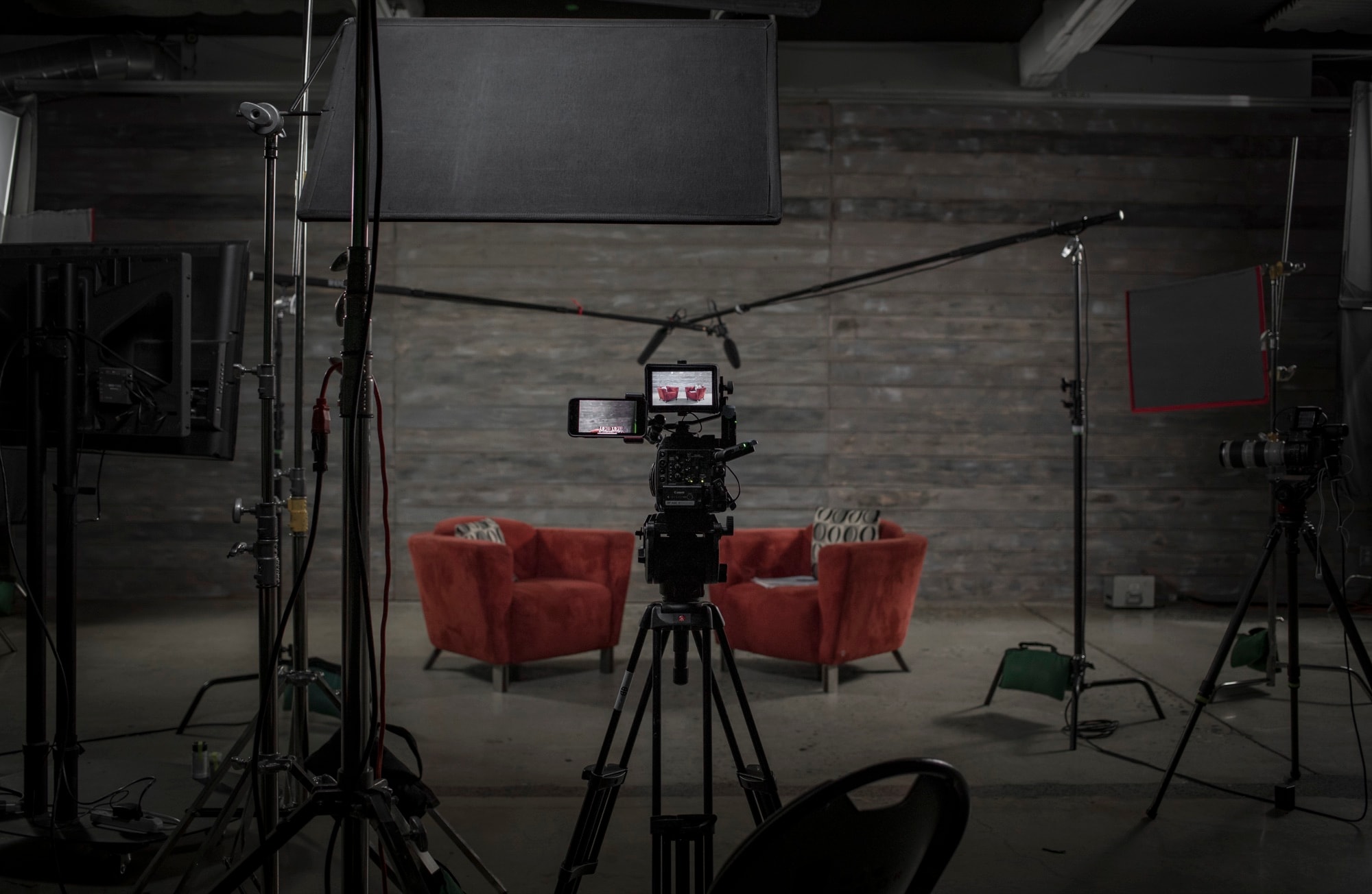 Empty Blue Barn corporate interview studio set with two chairs and professional lighting