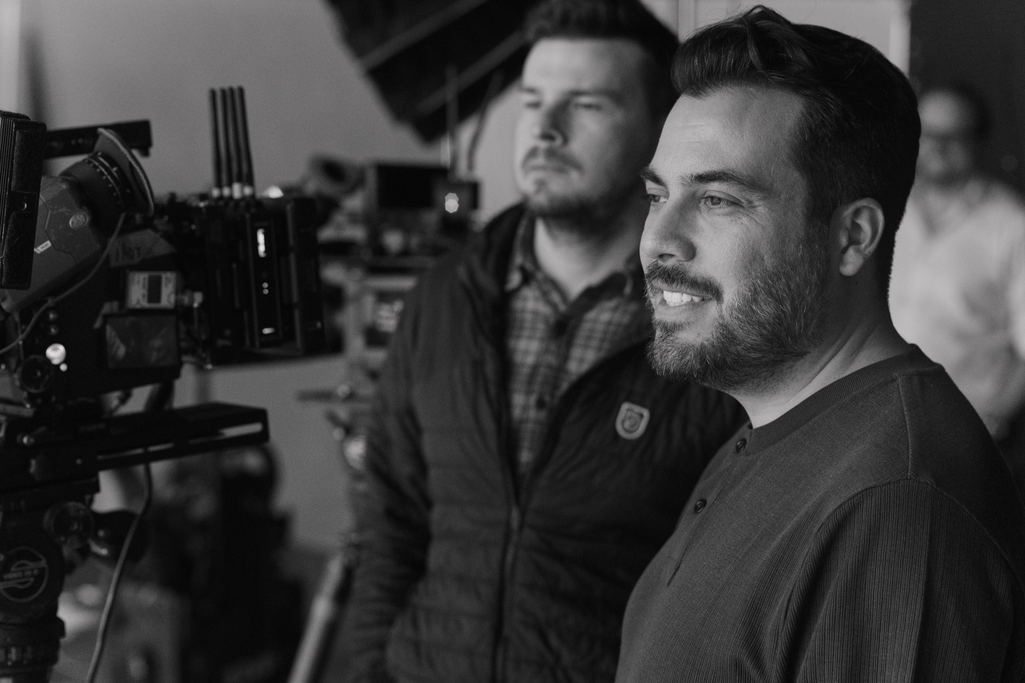 Carlos Foster directing a commercial production with crew and camera in frame