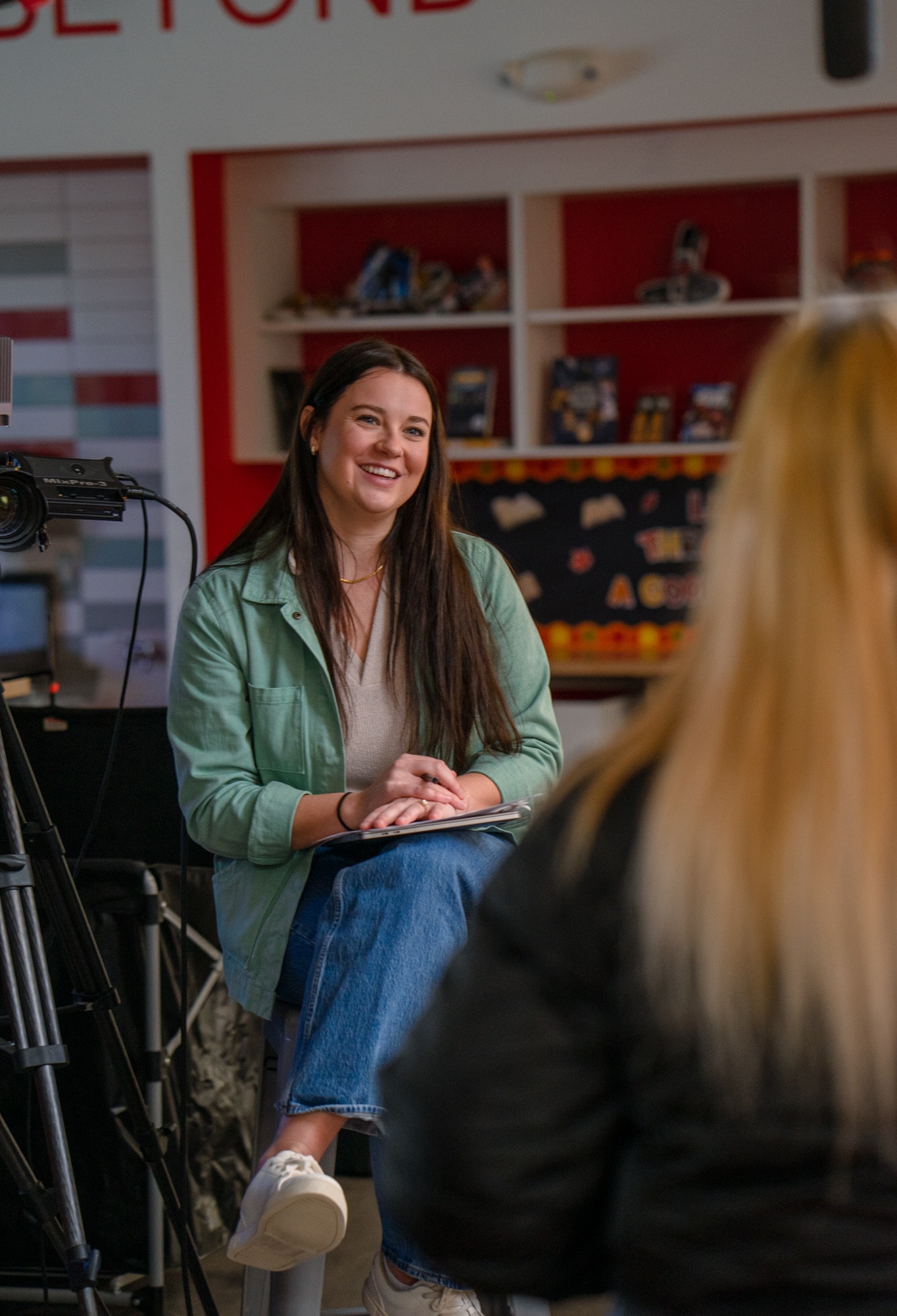 Student smiling during a Blue Barn customer story interview at a high school