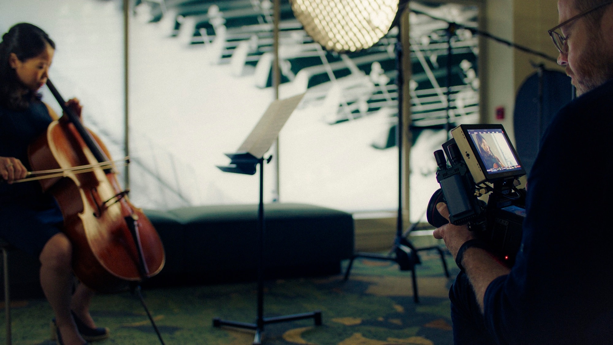Stephen Alberts filming a cellist on a brand film shoot