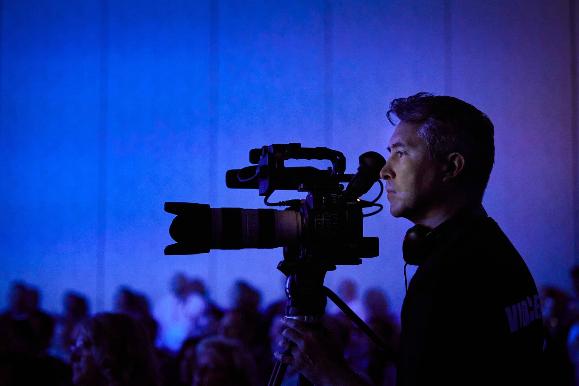 Blue Barn videographer operating a cinema camera on location at an event
