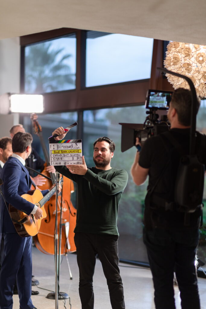 Carlos slates a shot as the band performs in the living room on the Frank Sinatra estate in Palm Springs.