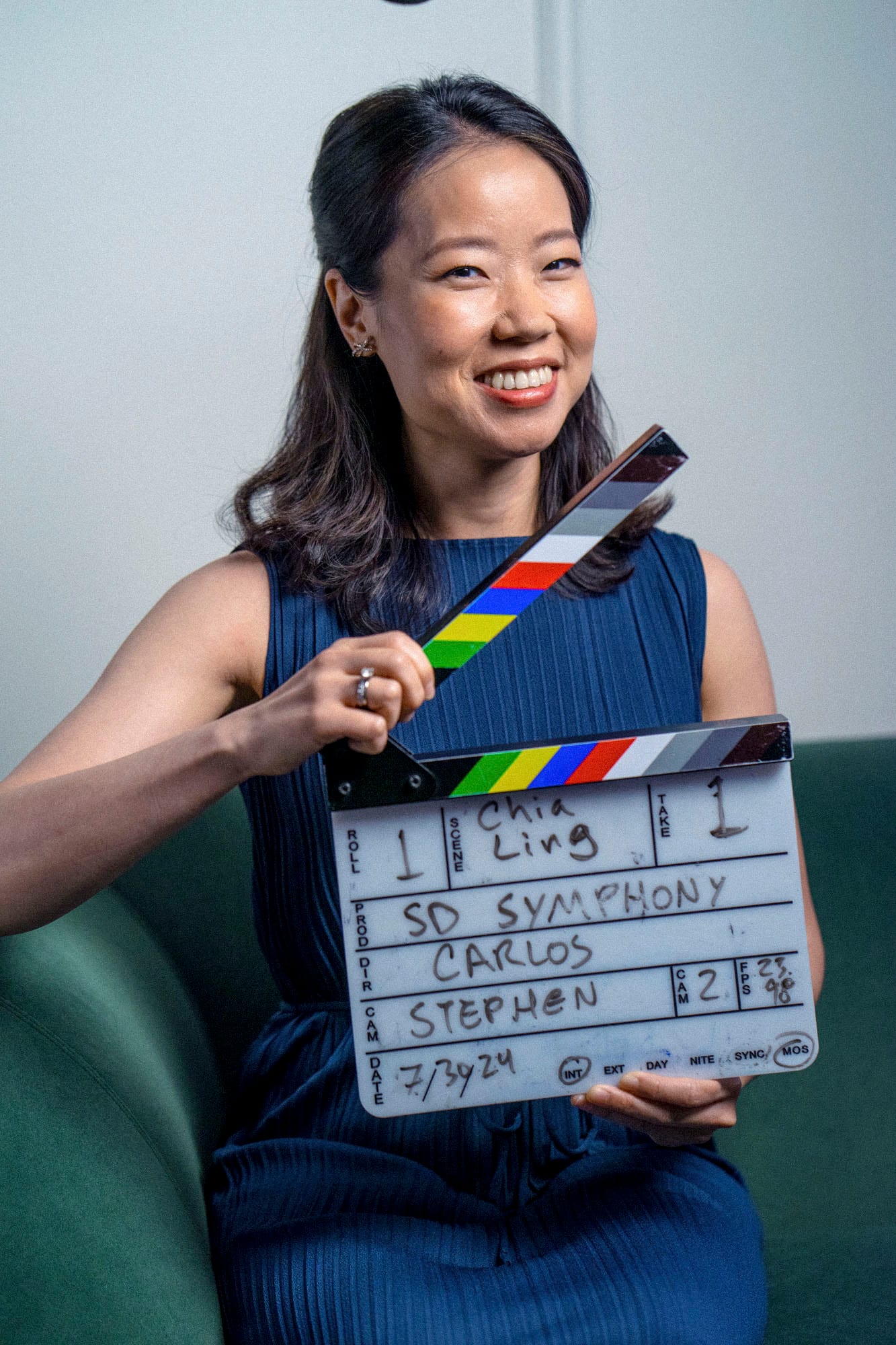Chia Ling holds the clapperboard before her on-camera interview for the SD Symphony project, July 2024